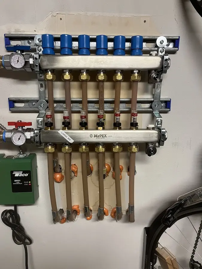 Plumber performing Water Heater Repair at a residential property in Fond du Lac